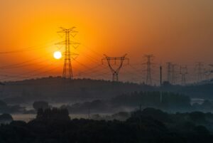 sunset behind power lines in texas